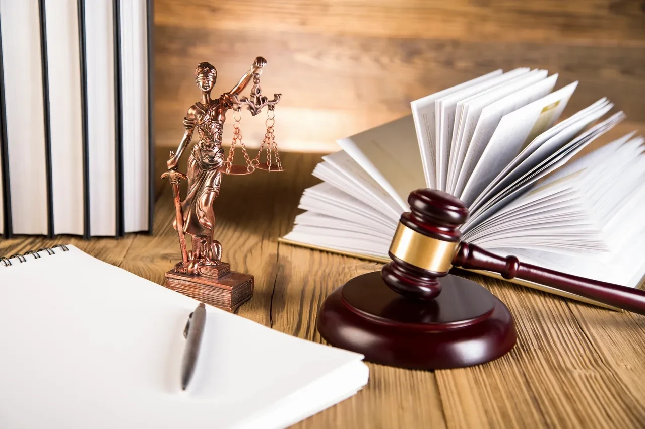 Law office desk with gavel and legal books